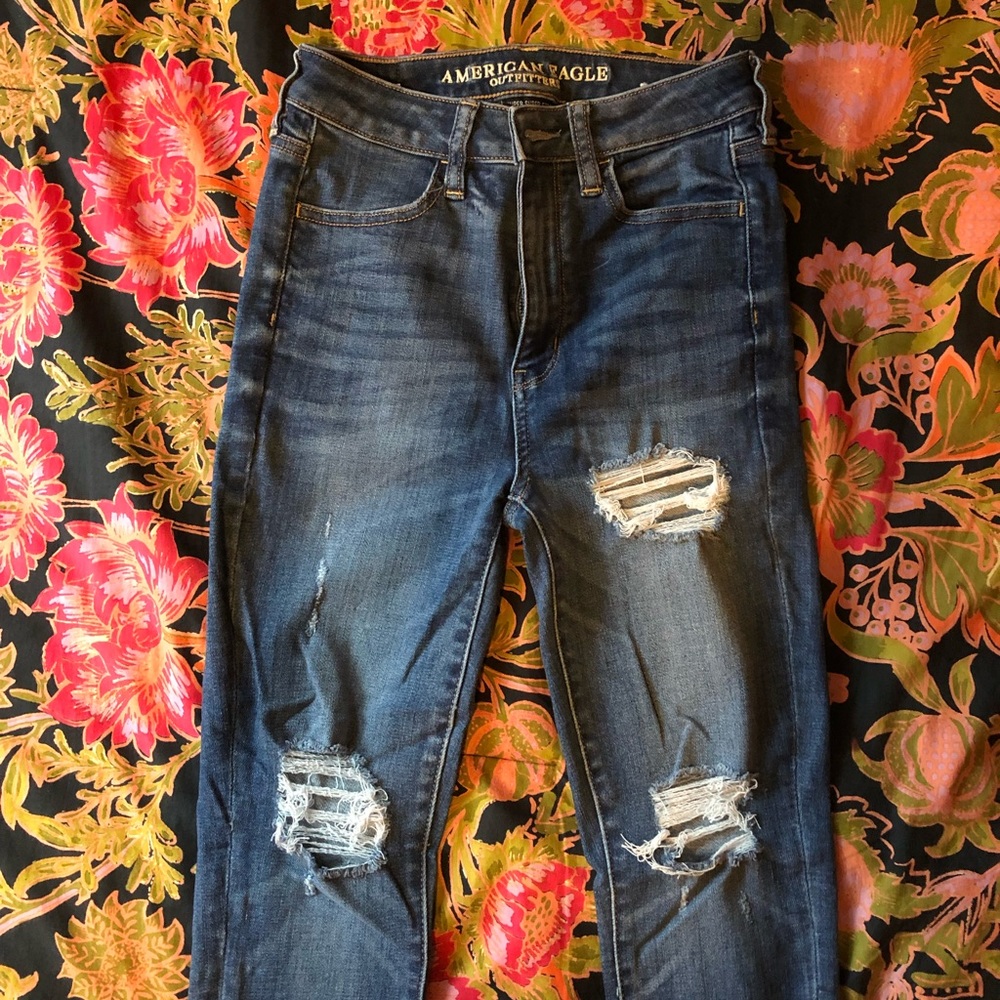 Medium wash, distressed high-rise jeggings. Size 2